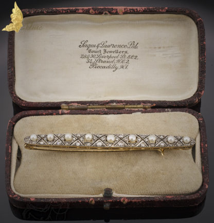 Antyczna brosza w białym i żóltym złocie pr. 750 z rozetami i 9 perełkami